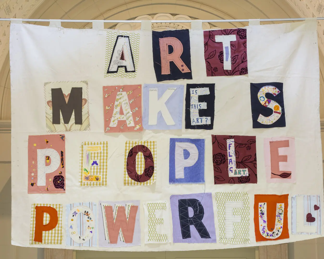 Bob and Roberta Smith, Art Makes People Powerful (2013), installed at the Free Library of Philadelphia for Framing Fraktur. Fabric with applique and embroidery. Courtesy of the Free Library of Philadelphia.