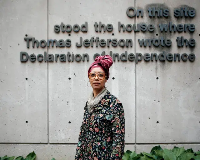 Sonya Clark stands in front of Declaration House in Philadelphia.